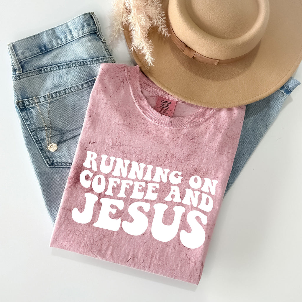 Pink Christian graphic t-shirt with Running on Coffee and Jesus front print