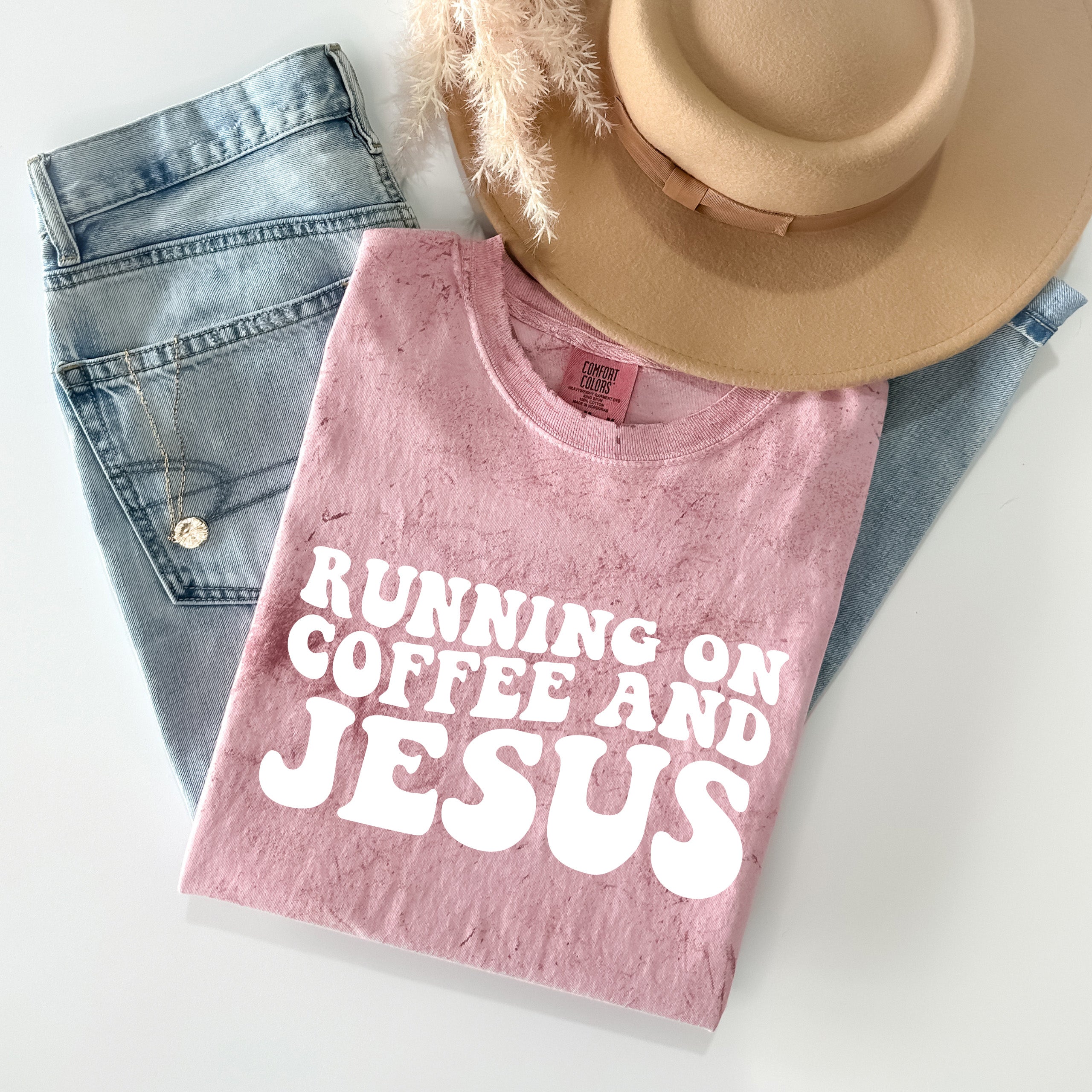 Pink Christian graphic t-shirt with Running on Coffee and Jesus front print