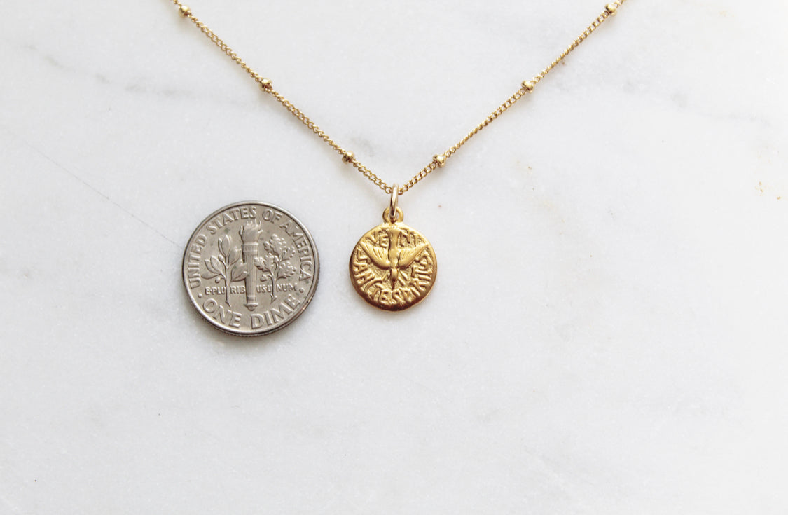 Gold chain necklace with round coin-style Holy Spirit pendant