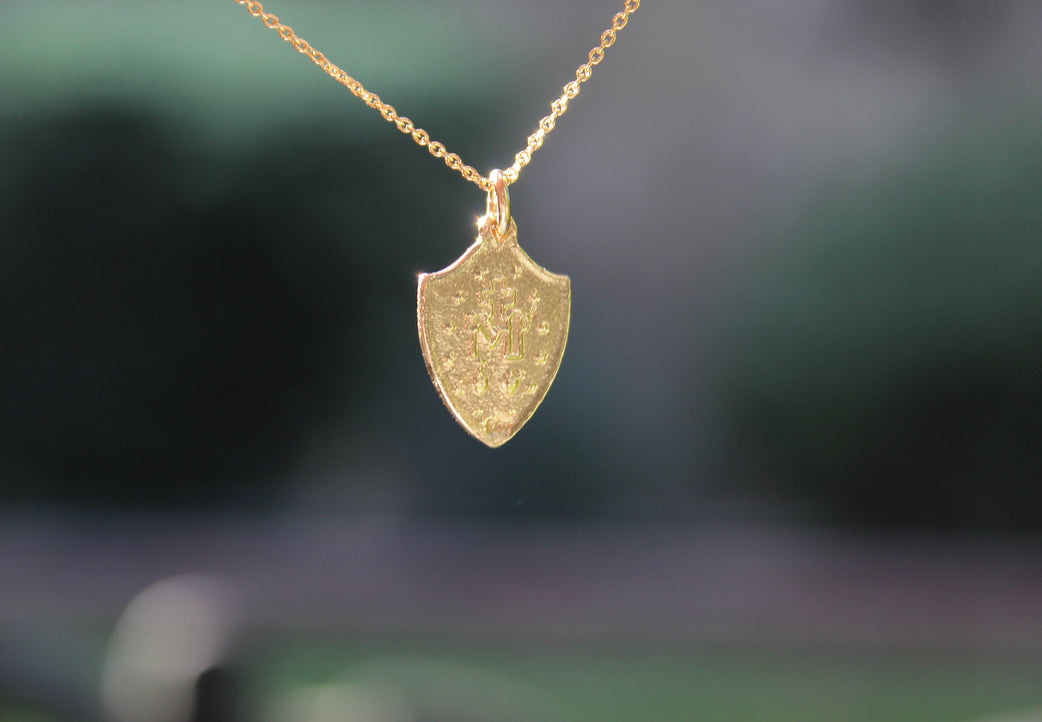 14K gold chain necklace with shield pendant featuring Miraculous Medal style figure