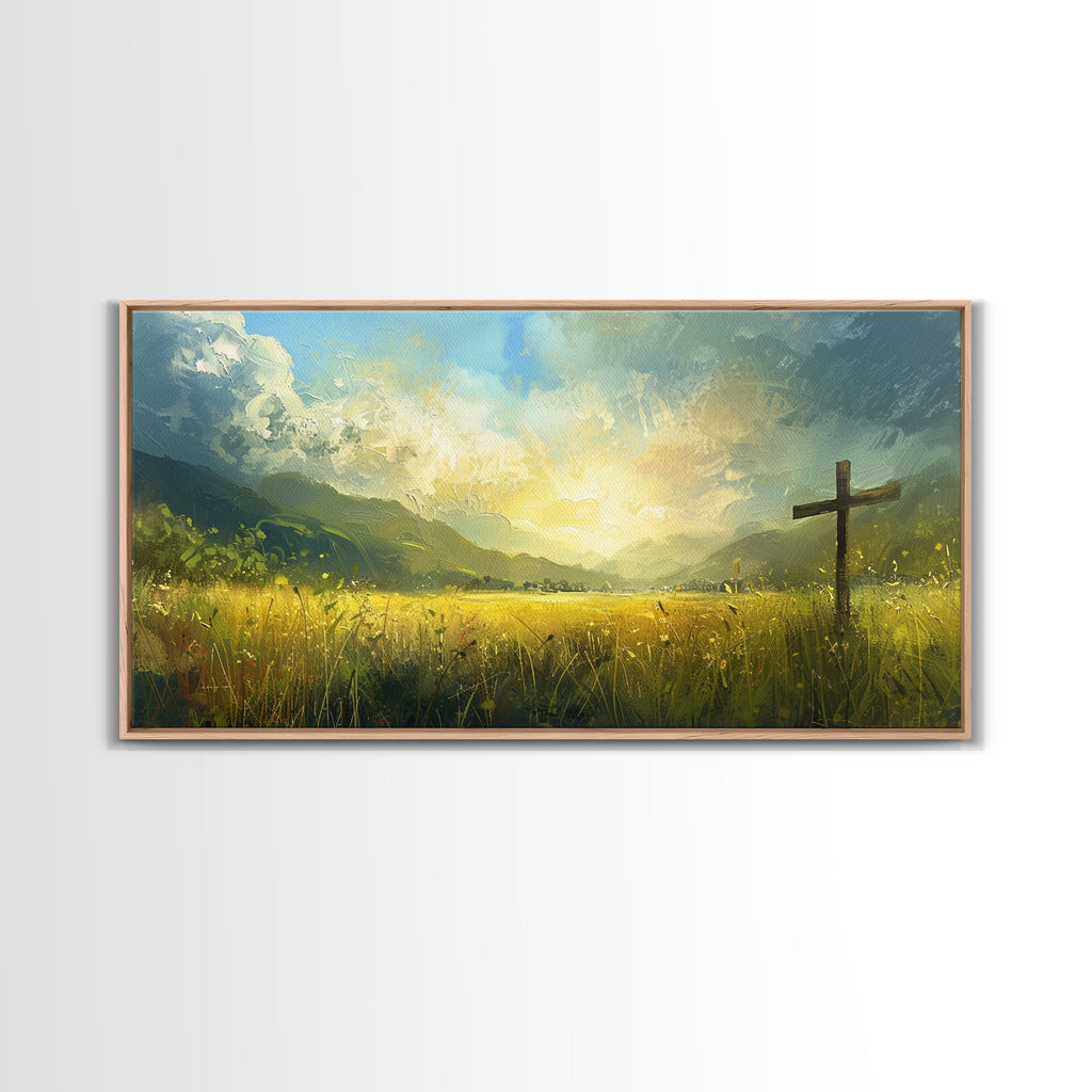 Framed canvas print featuring a dark cross beside a sunlit grassy landscape