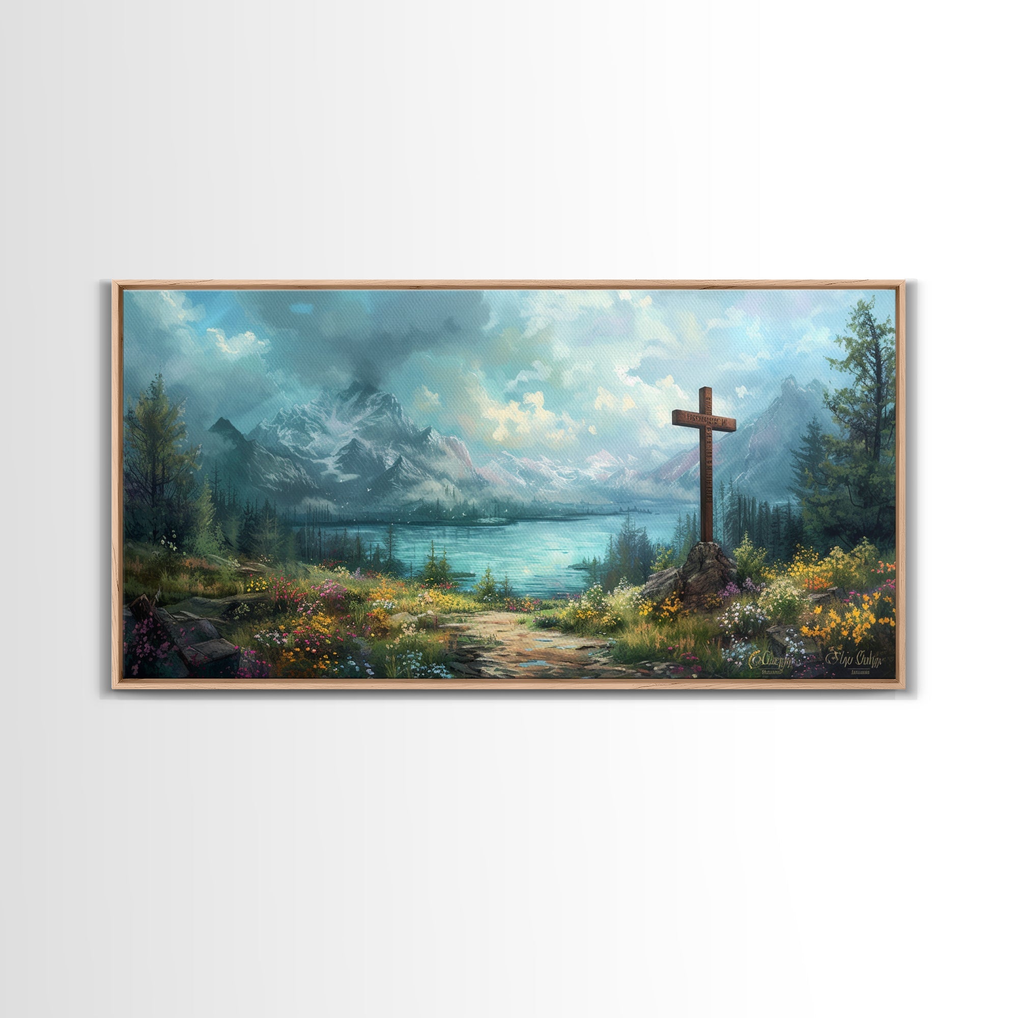 Light wood framed canvas print of mountain landscape with wooden cross by a lake