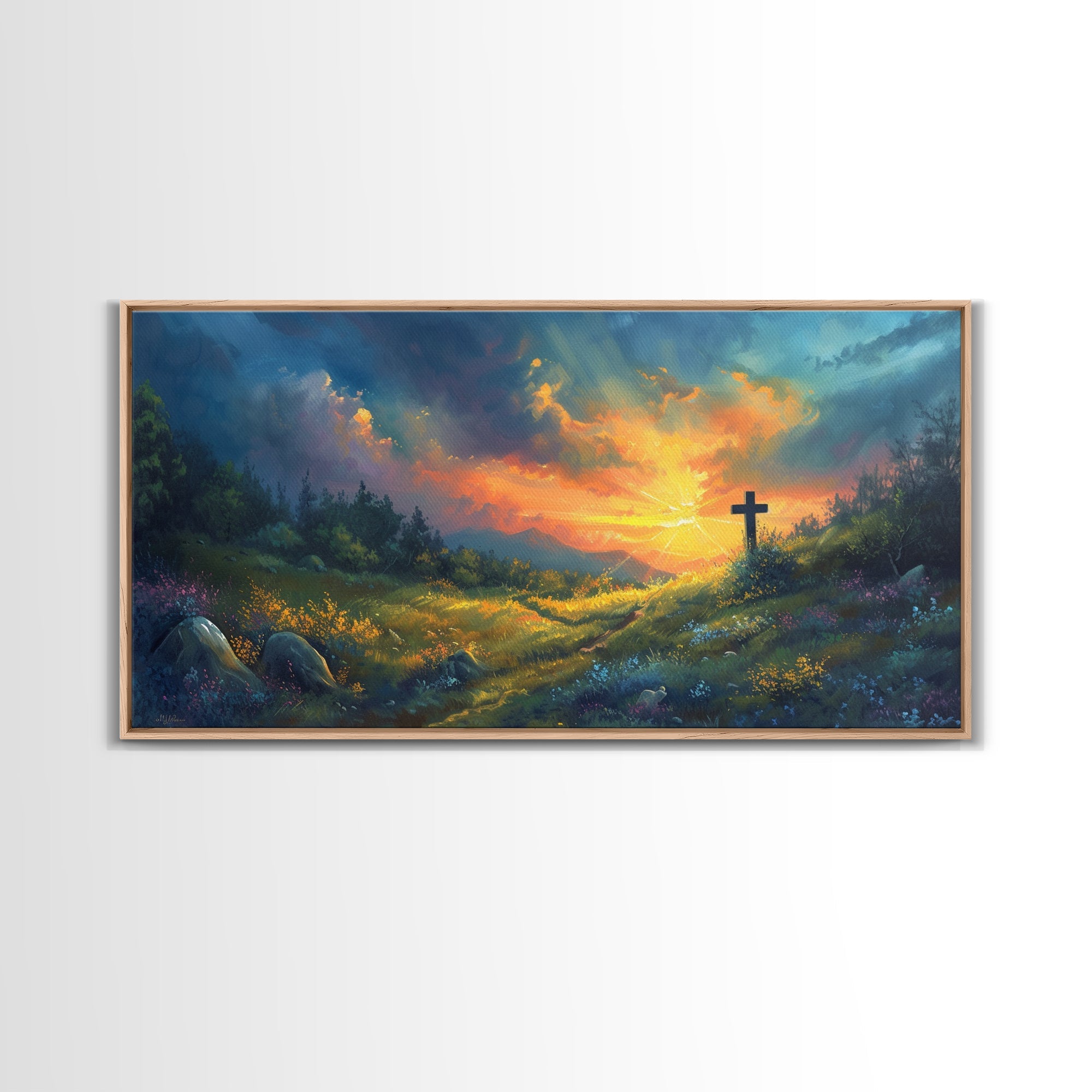 Christian framed canvas wall art with a dark cross over a sunset valley scene