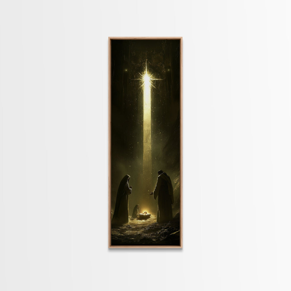 Nativity painting print in a light oak frame with glowing star over two kneeling figures