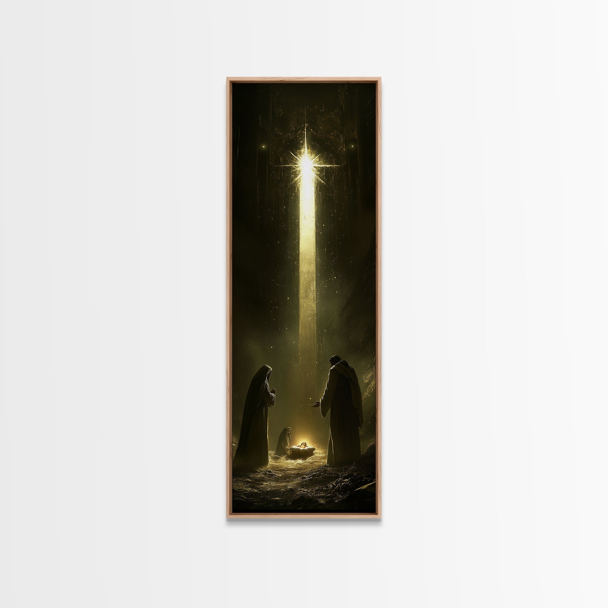 Nativity painting print in a light oak frame with glowing star over two kneeling figures