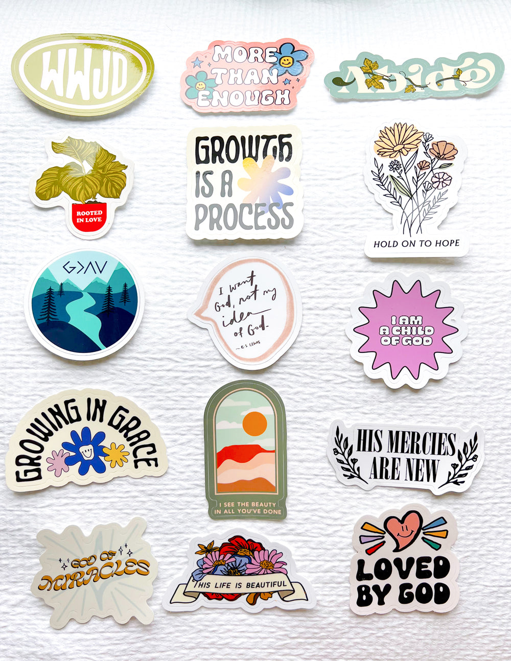 Faith-themed sticker sheet with various icons, leaves, and scripture-style quotes.
