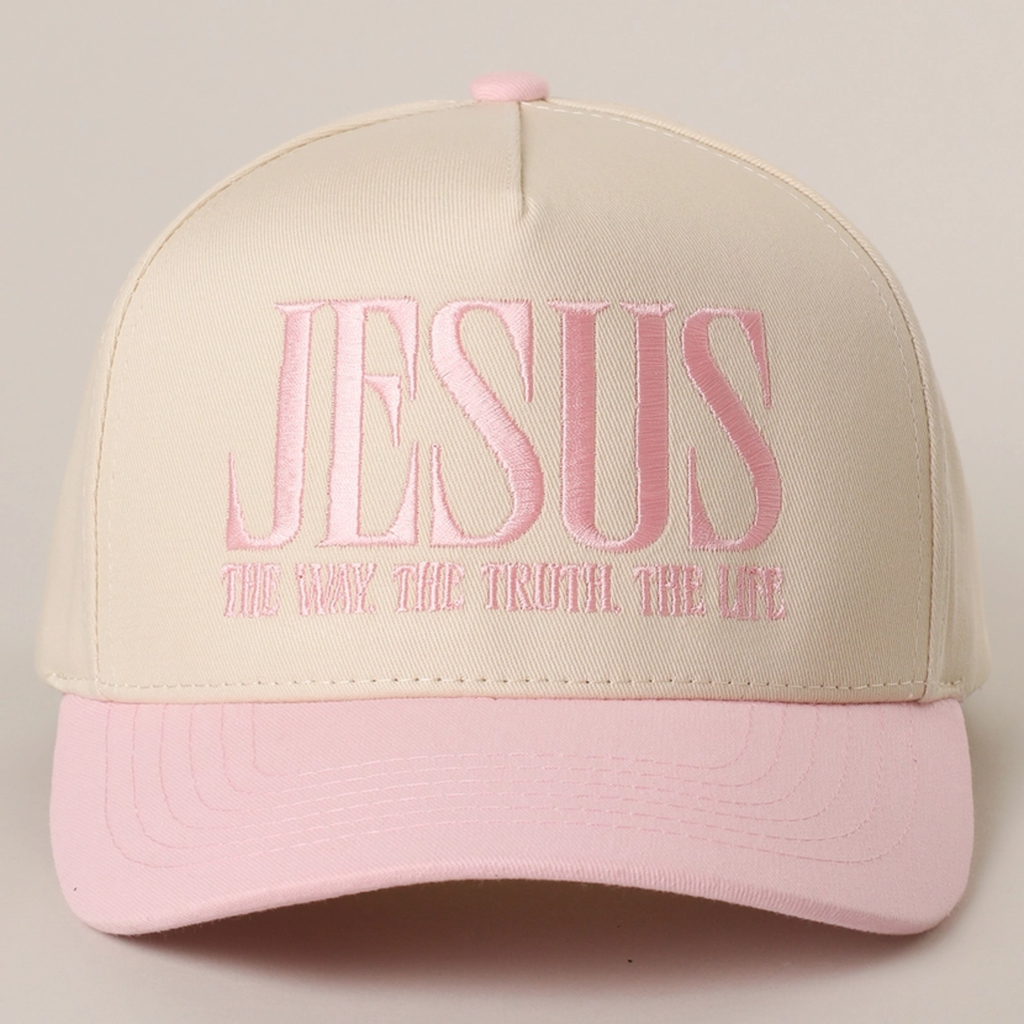 Sand baseball cap with light pink brim and embroidered “JESUS” slogan on front