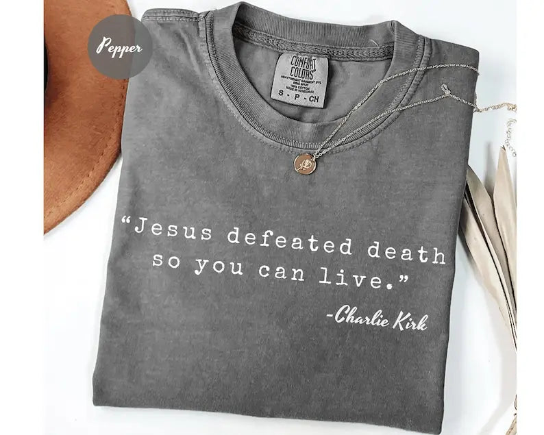 Charcoal crewneck T-shirt with 'Jesus defeated death' graphic and small pendant