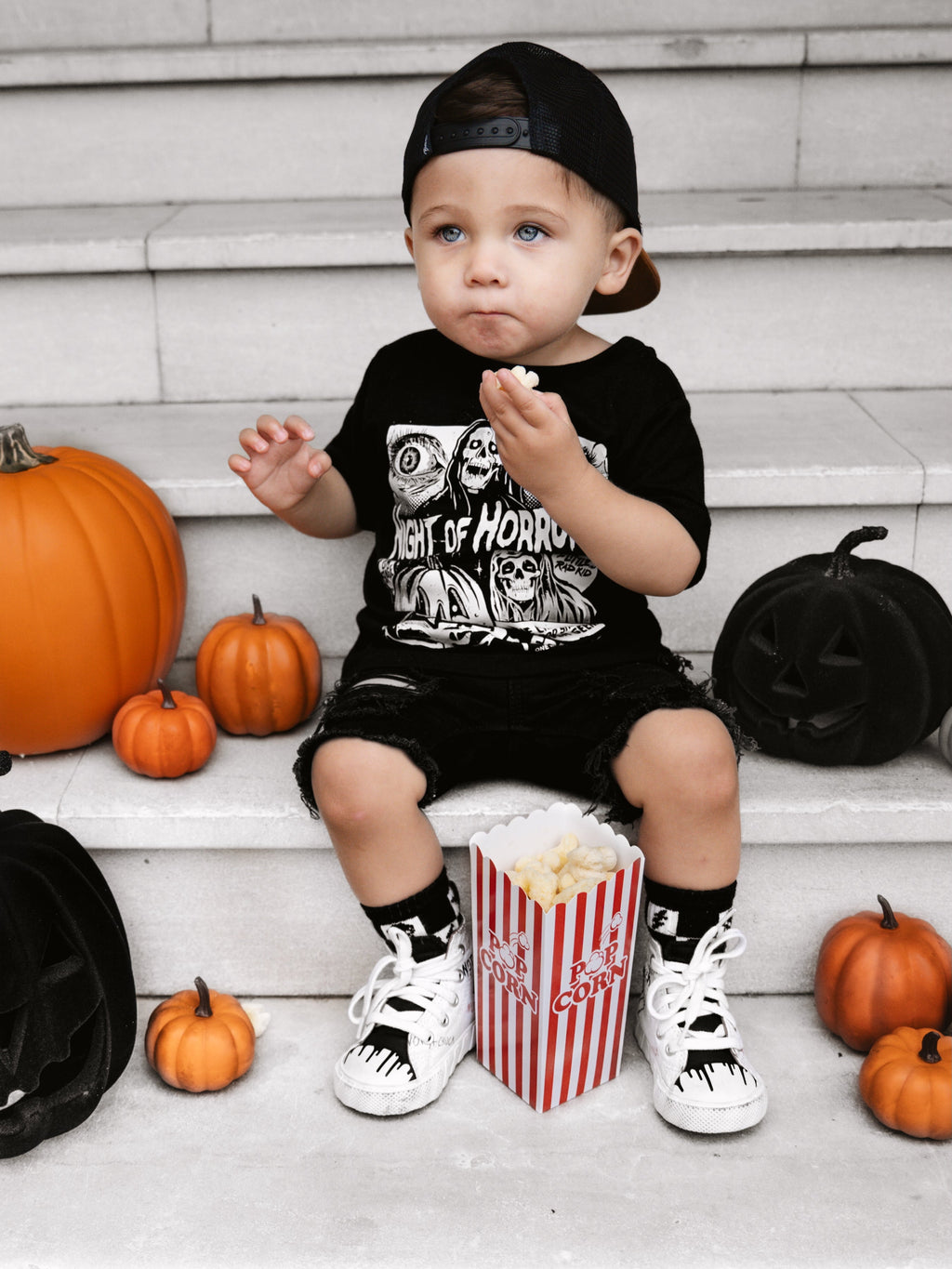 Black kids graphic T-shirt with horror faces and “Friday Oct. 13” lettering