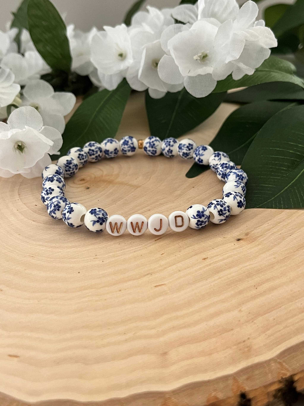 Blue and white patterned bead bracelet with WWJD letter beads
