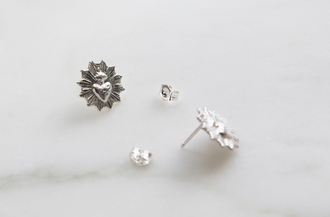 Silver-tone sacred heart stud earrings, starburst heart medallion