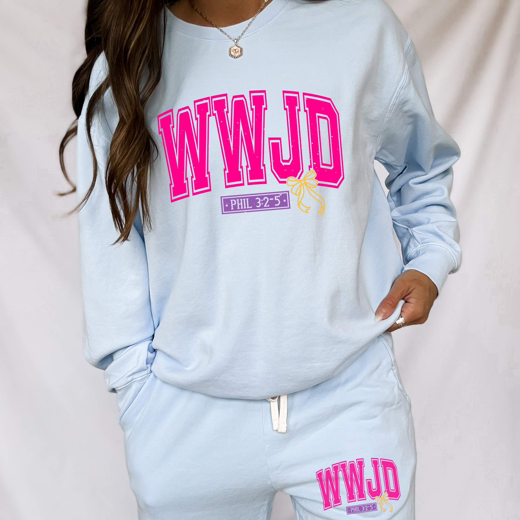 Kendall's Collection crewneck sweatshirt in light blue with pink WWJD graphic