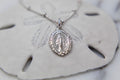 Silver-tone oval miraculous medal pendant necklace with linked chain