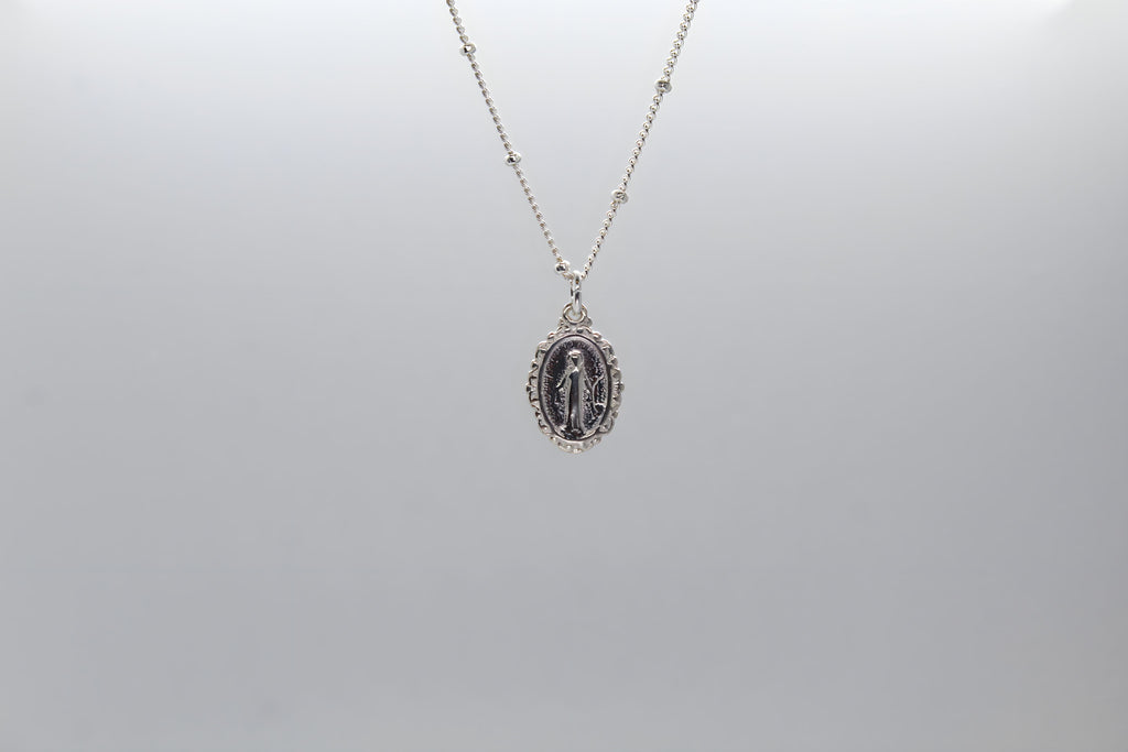 Silver-tone oval miraculous medal pendant necklace with thin chain
