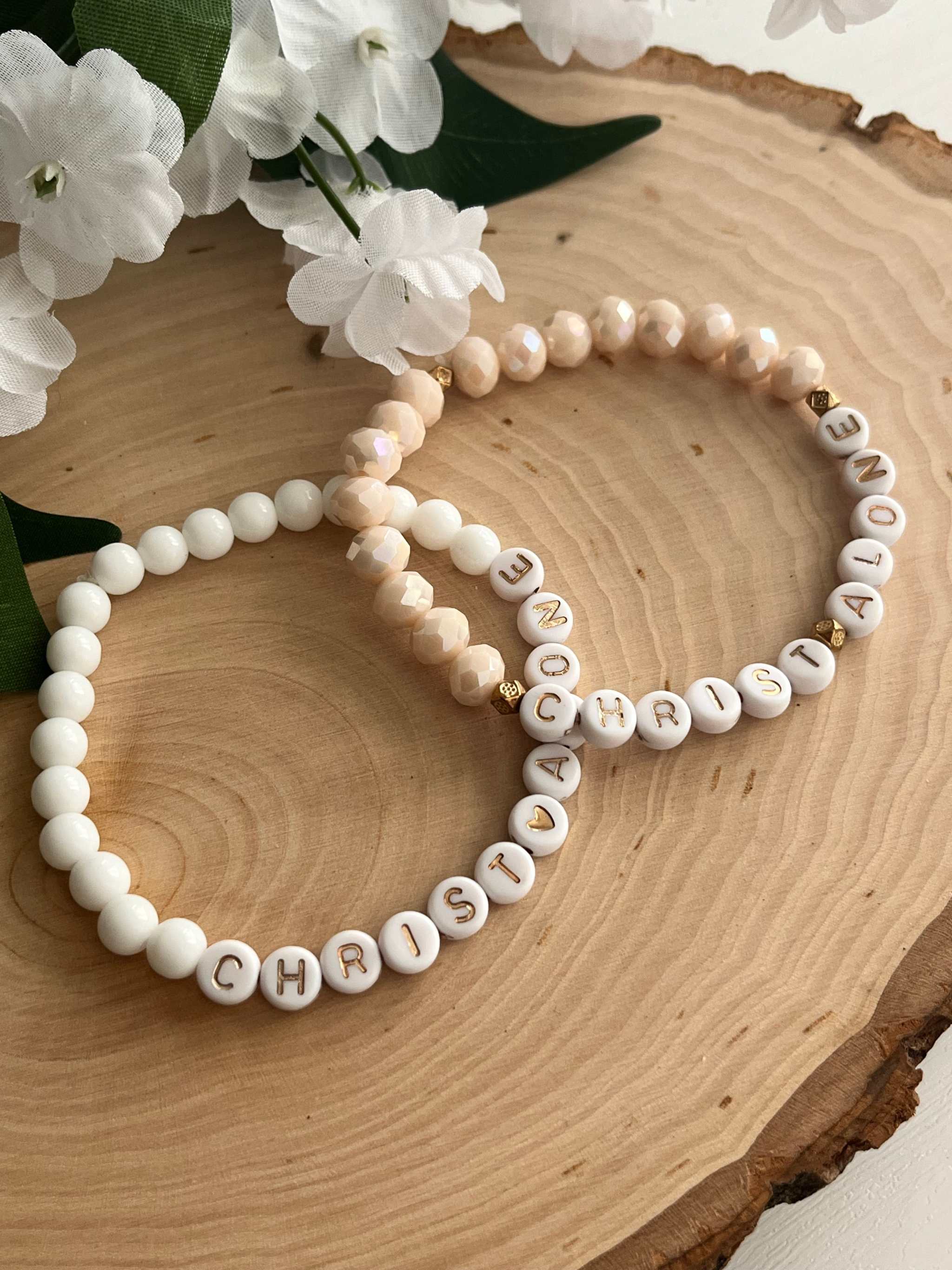 Bead bracelet set of two: letter beads spelling "CHRIST ALONE" in white and peach