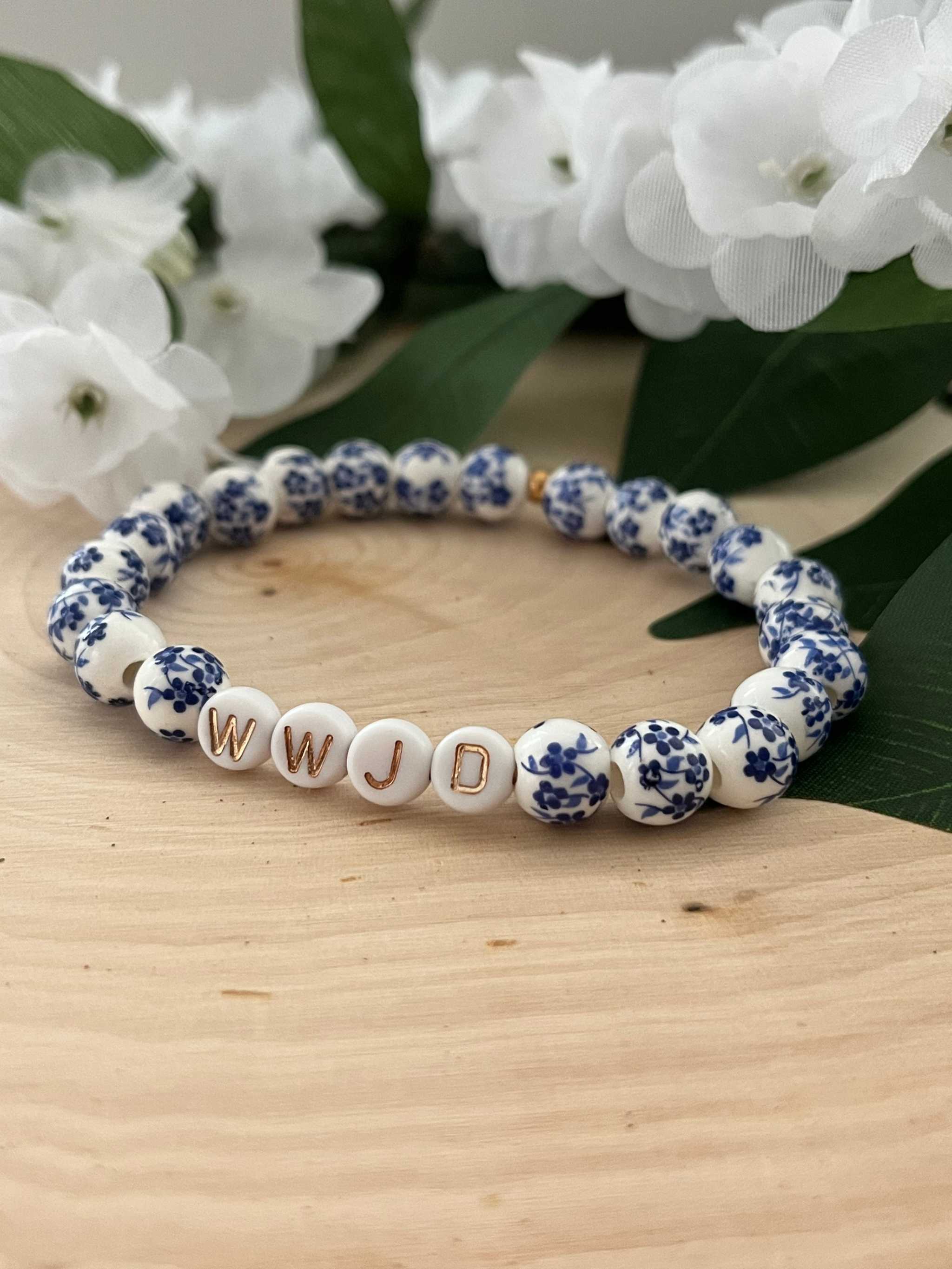 Blue and white floral bead bracelet with WWJD letter beads and round spacer beads