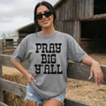 Gray graphic T-shirt with bold black 'PRAY BIG Y'ALL' block text