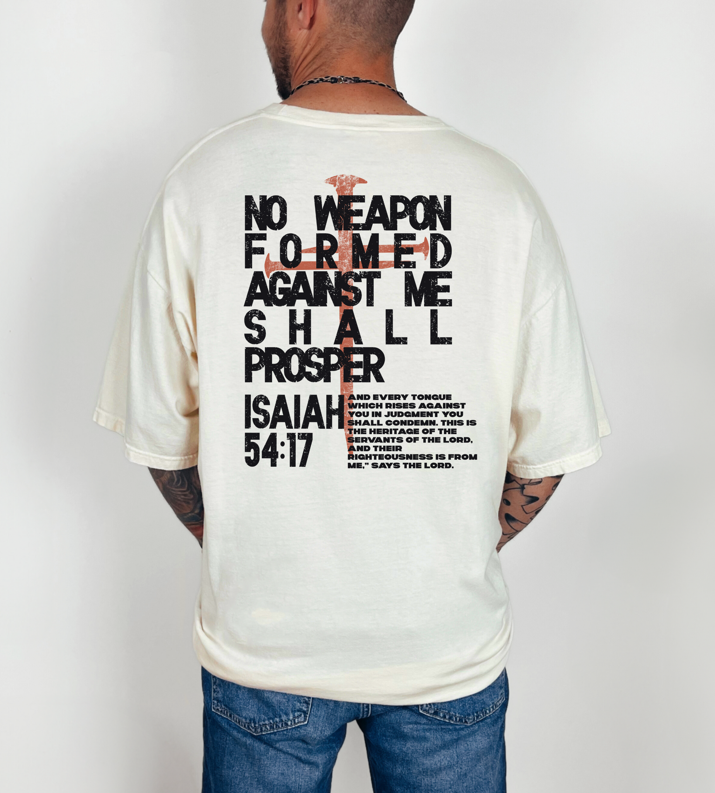 Cream crewneck T-shirt with large back quote 'No Weapon Formed' and Isaiah 54:17