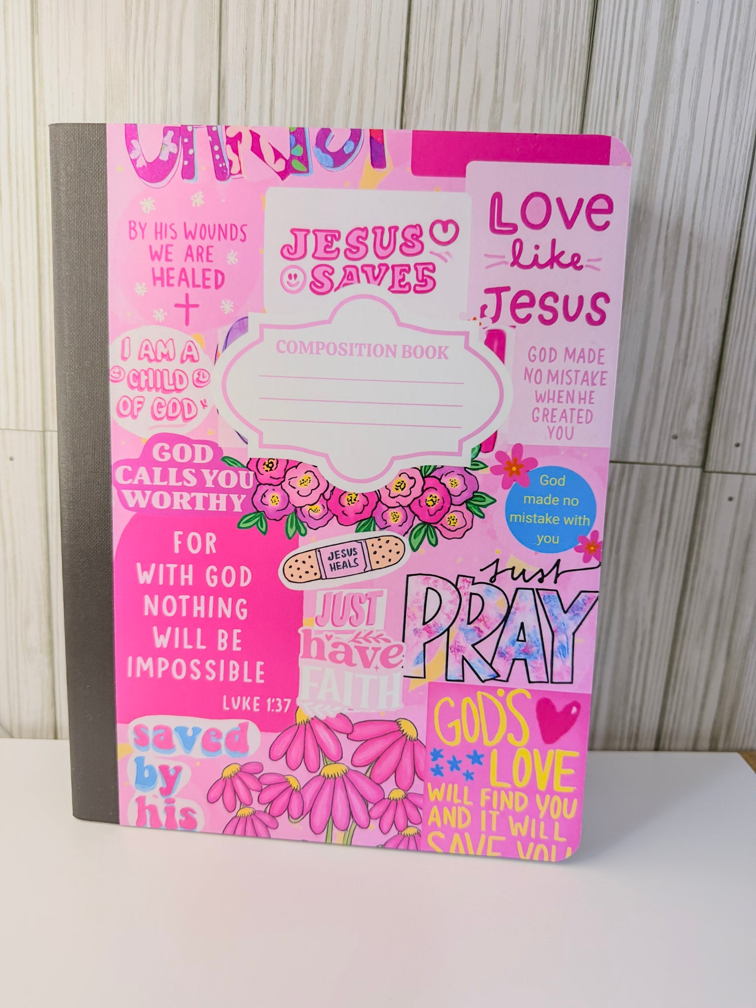 Girls' faith composition book with pink floral cover and faith quote lettering