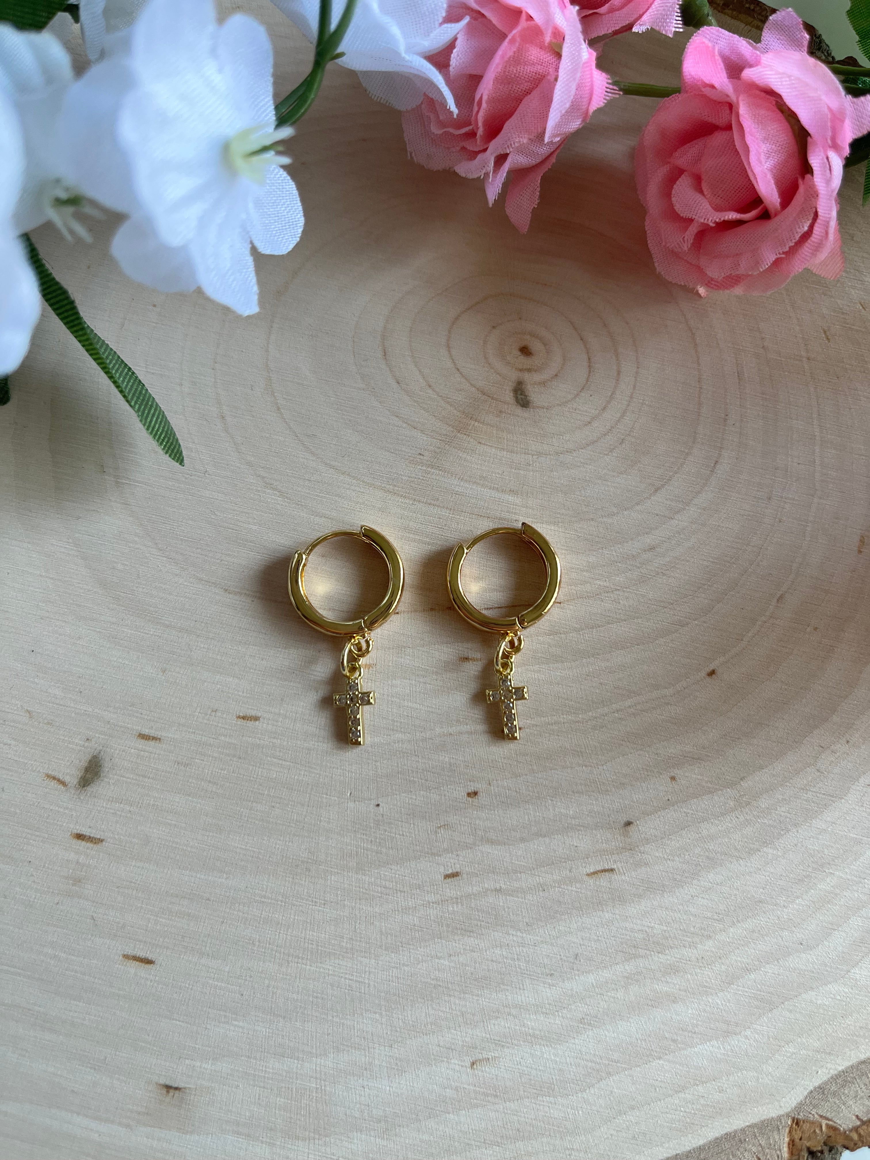 Gold hoop cross earrings with dangling cross details