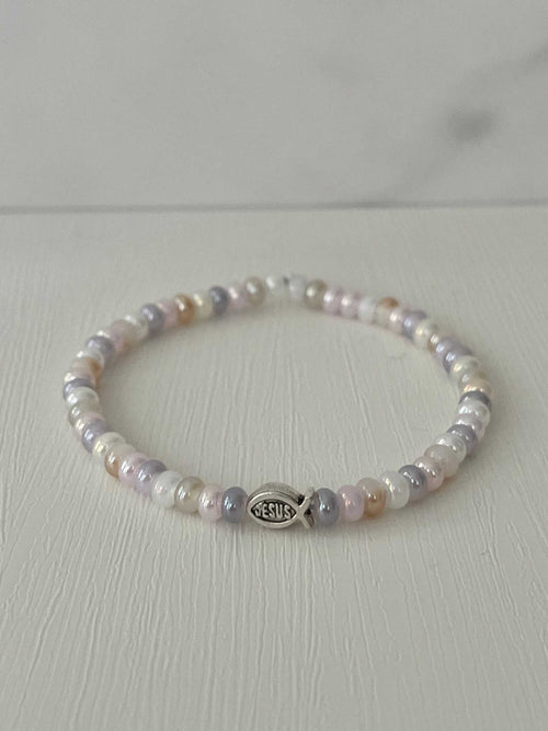 Freshwater pearl bead bracelet with round beads and small “JESUS” charm