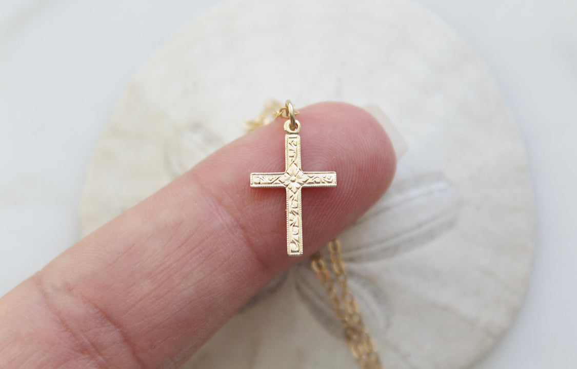 Gold cross pendant necklace with rectangular center cross details