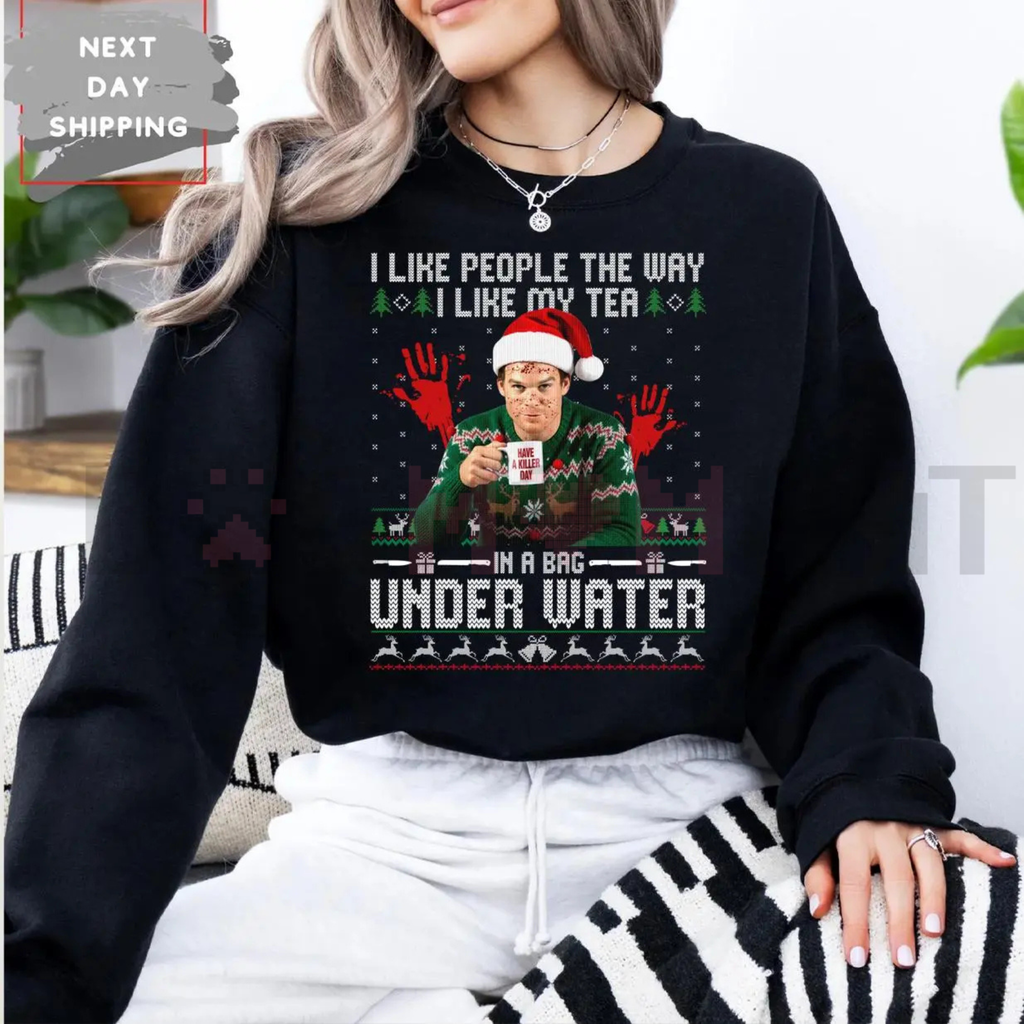 Black crewneck sweatshirt with Under Water graphic and holiday hat print