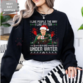 Black crewneck sweatshirt with Under Water graphic and holiday hat print