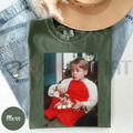 Moss green Christmas t-shirt with front photo graphic of a boy holding toys