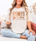 Cream crewneck T-shirt with large front typographic print and bow graphic