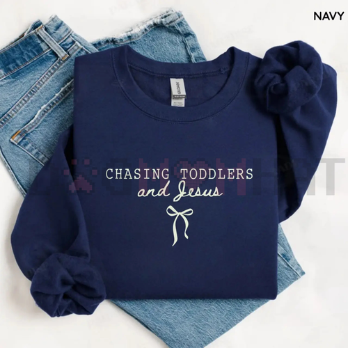 Navy sweatshirt with puff sleeves and 'Chasing Toddlers and Jesus' graphic