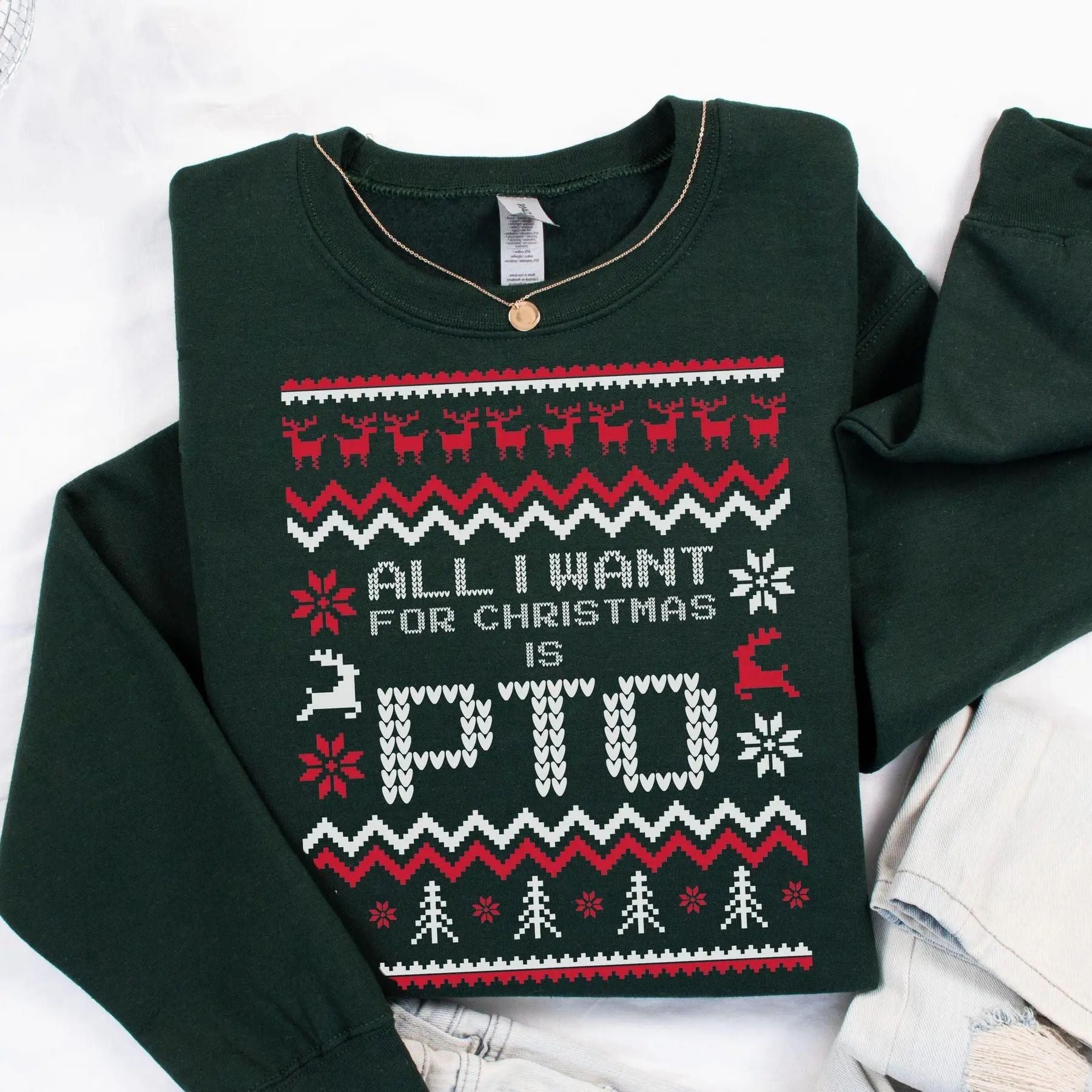 Dark green Christmas sweater with reindeer pattern and “All I Want For Christmas Is PTO”
