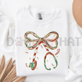 White Christmas nurse sweatshirt with colorful bow and candy cane graphic on front