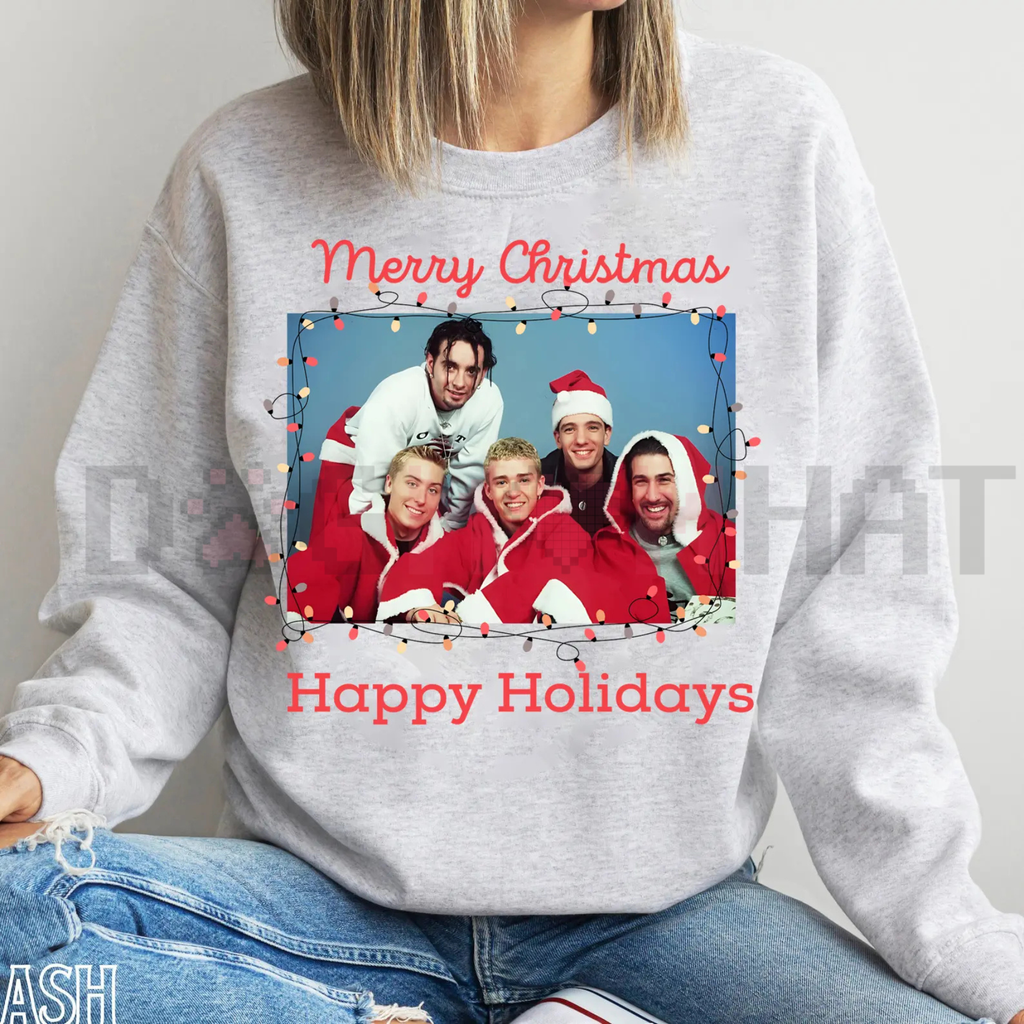 Light gray crewneck sweatshirt with colorful Christmas group graphic and red text