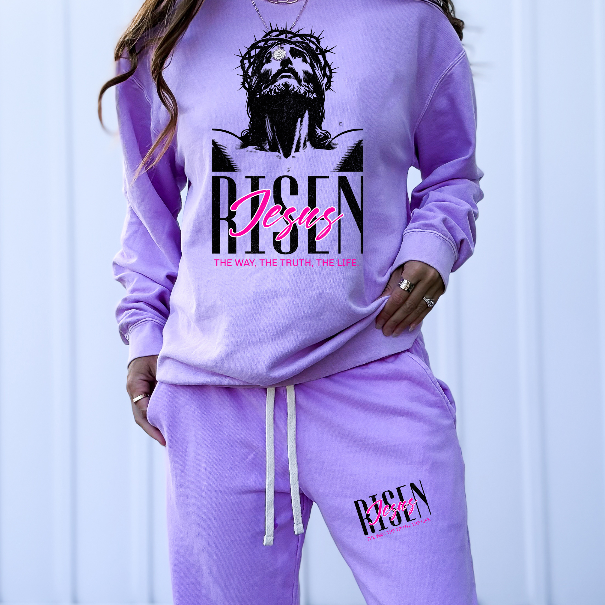 Neon violet crewneck sweatshirt with Jesus graphic and pink text, long sleeves