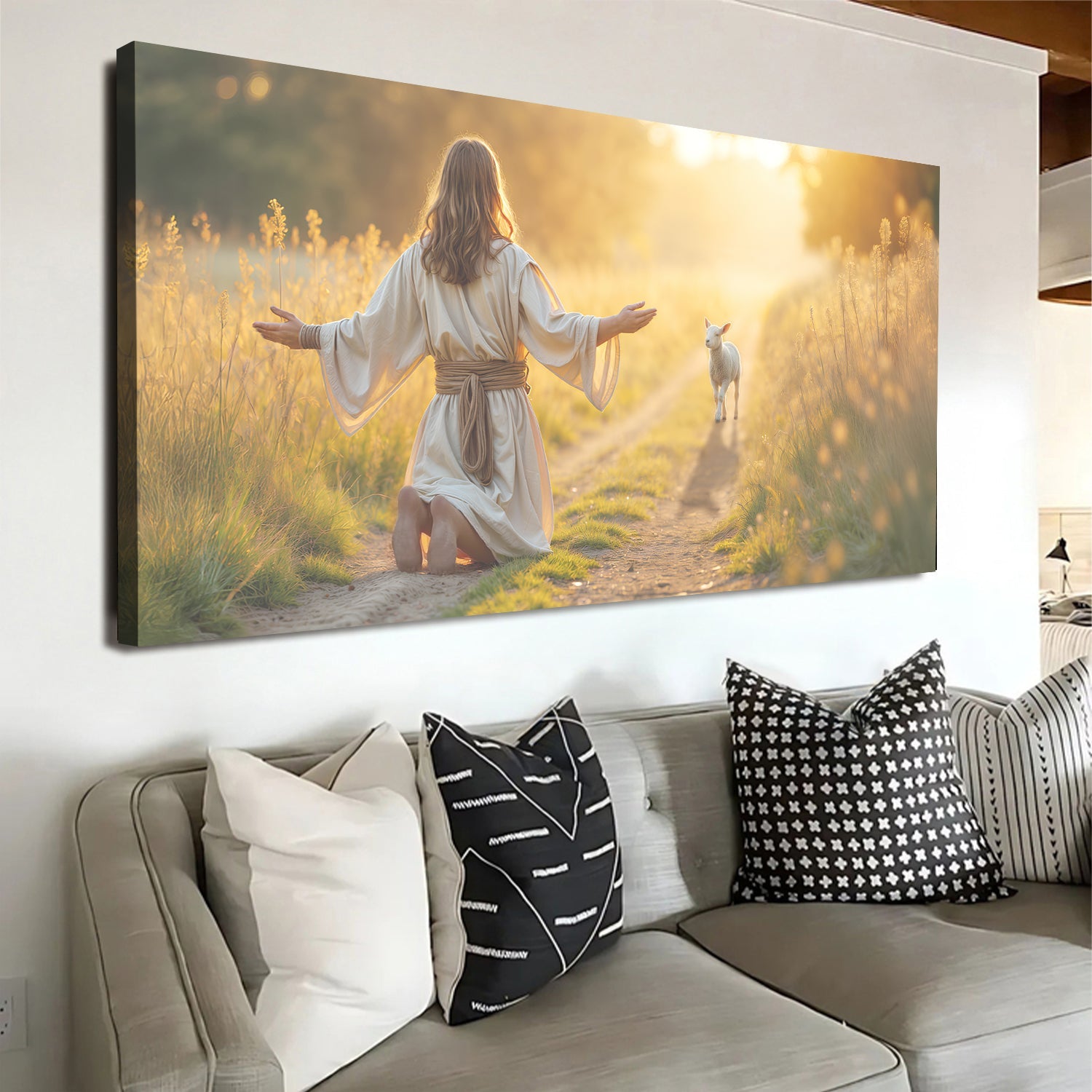 Framed landscape canvas wall art with kneeling woman in white robe and small lamb in field