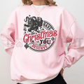 Pink sweatshirt with gothic back graphic: “Have the Christmas you deserve”.