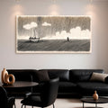 Landscape canvas wall art with a sailboat on dark waves and white cloud shapes