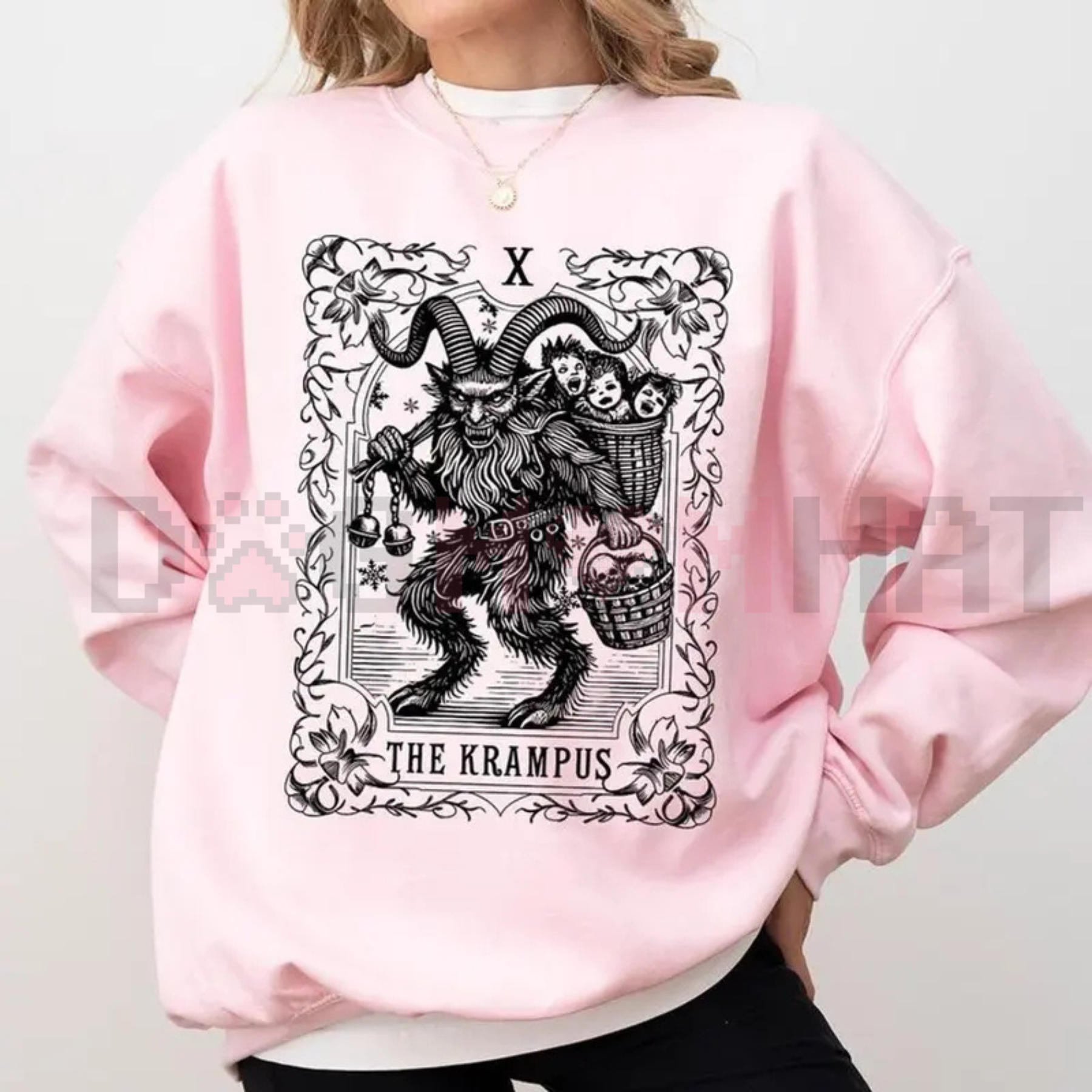 Light pink sweatshirt with gothic Krampus graphic centered on the front