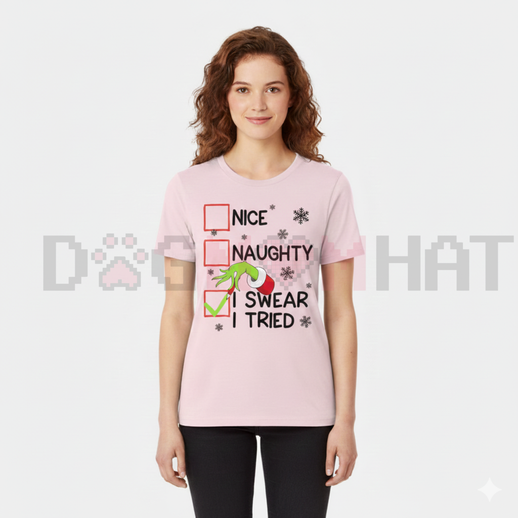 Light pink unisex Christmas graphic tee with Nice/Naughty and 'I Swear I Tried' text