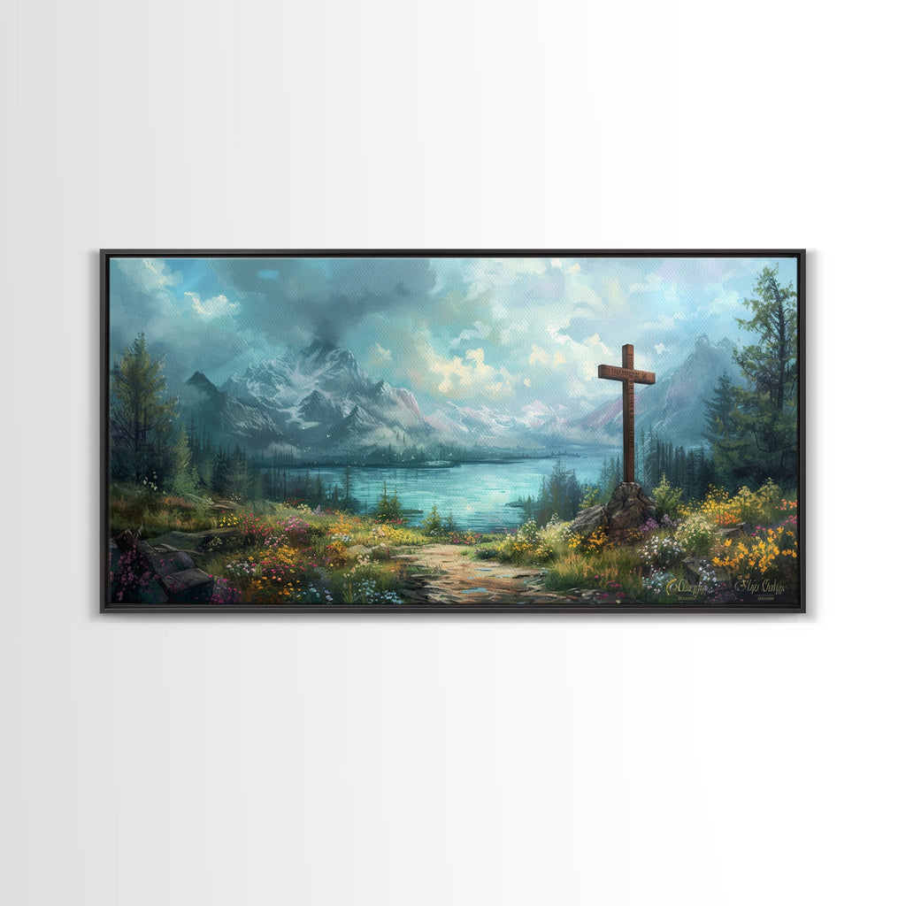 Black framed canvas print of mountain landscape featuring a wooden cross and lakeshore