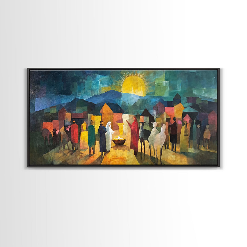 Dark-framed nativity scene art print with village crowd, lit candle, and bright yellow sun