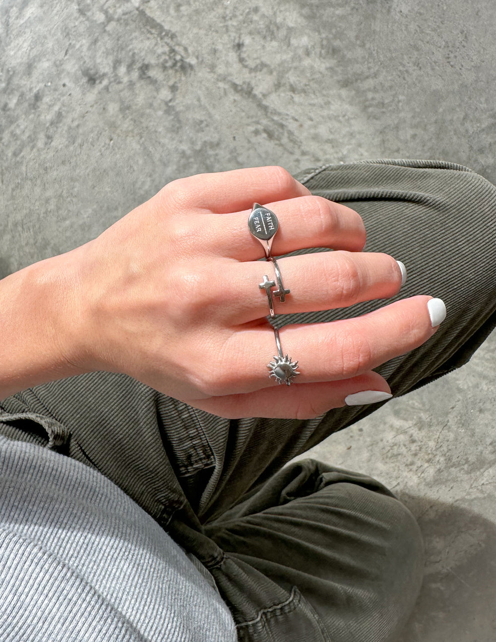 Silver cross wrap ring with raised cross front on slim open band