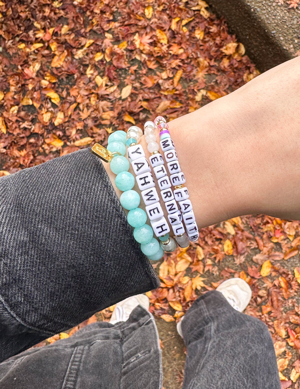 Multi-strand beaded letter bracelets with turquoise beads and white letter tags