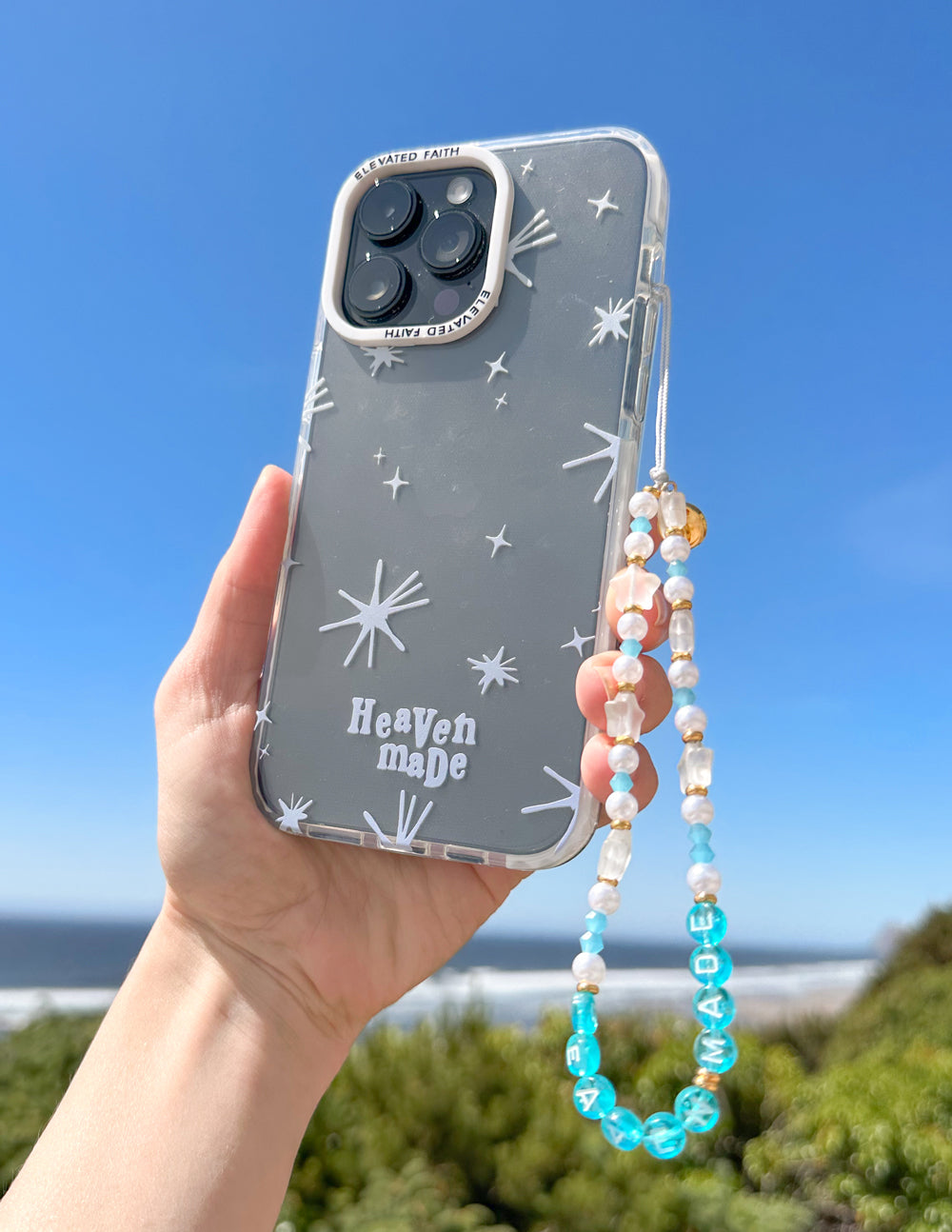 Heaven Made phone case, dark blue stars design with camera cutouts and beaded strap