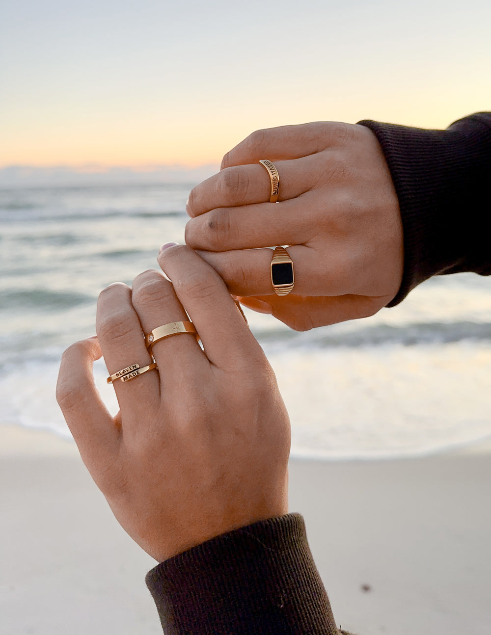 Gold-tone engraved ring with dark square-faced accent