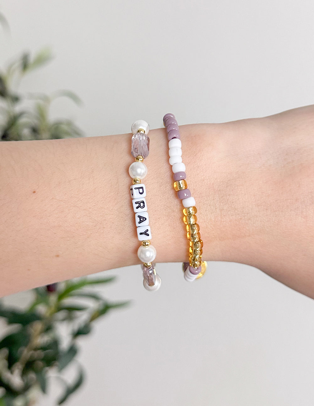 Beaded letter bracelet with PRAY and pearl beads, gold and lilac accents