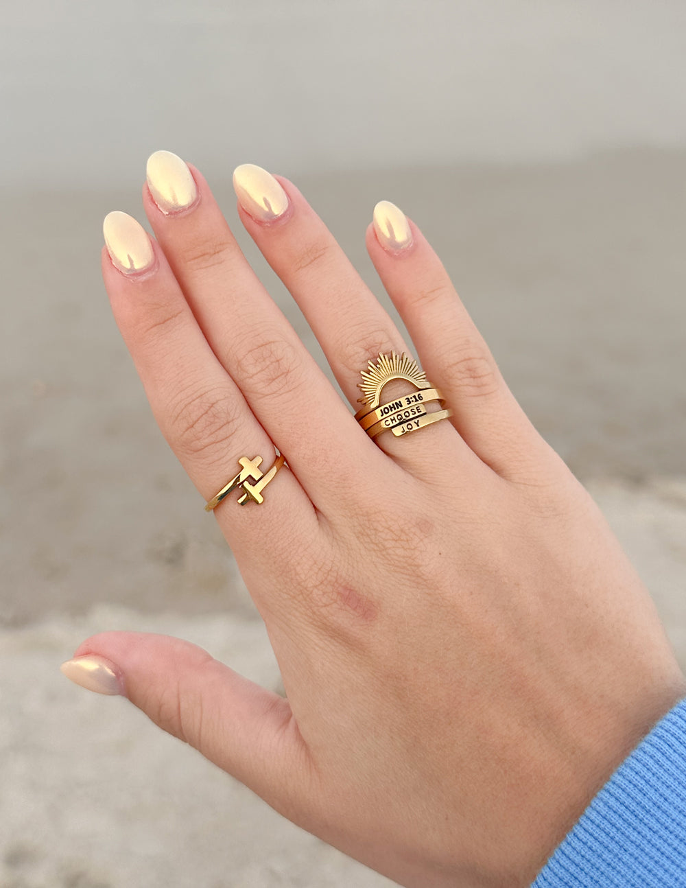 Gold ring with sunburst detail and black 'CHOOSE JOY' lettering