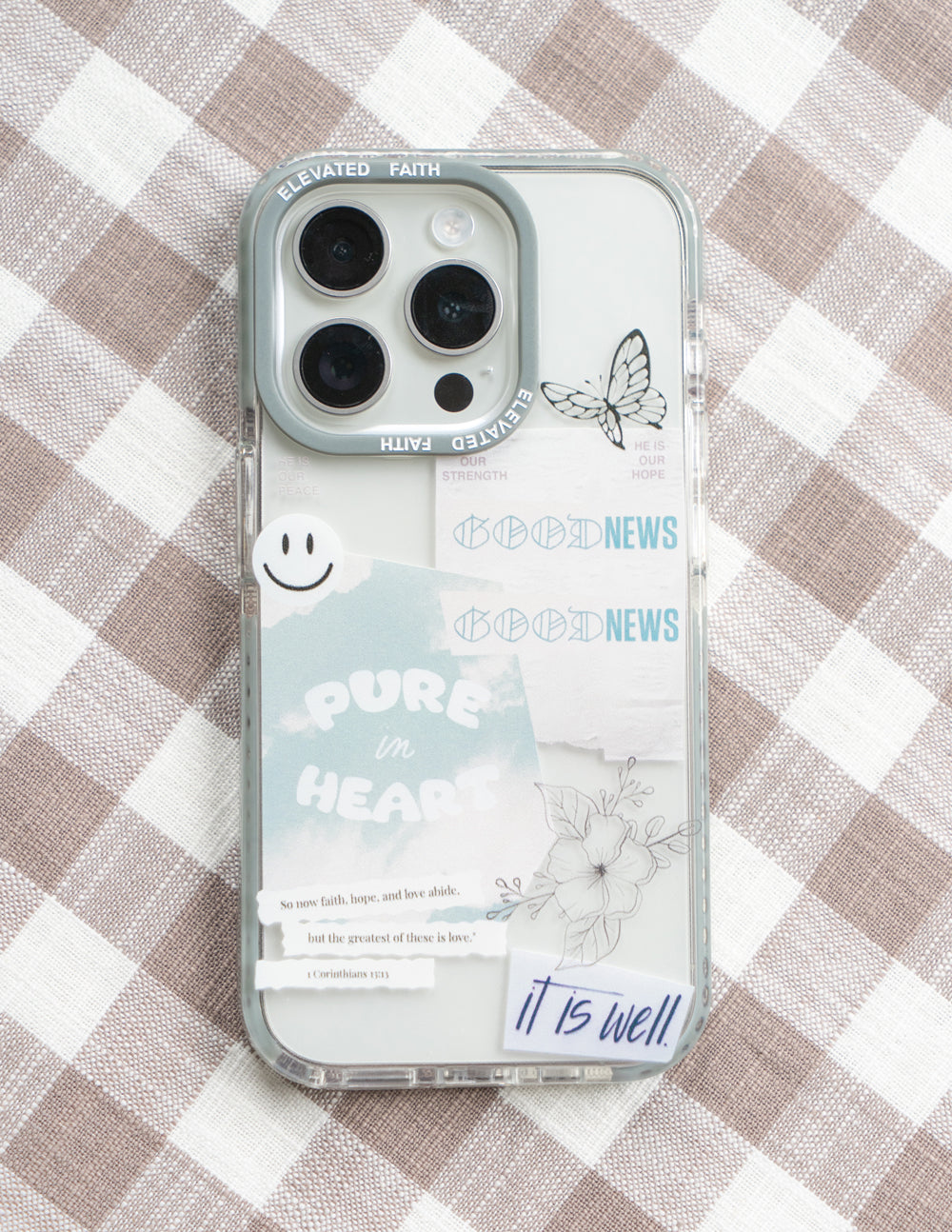 Transparent phone case with light blue border, butterfly print and 'It is well' footer
