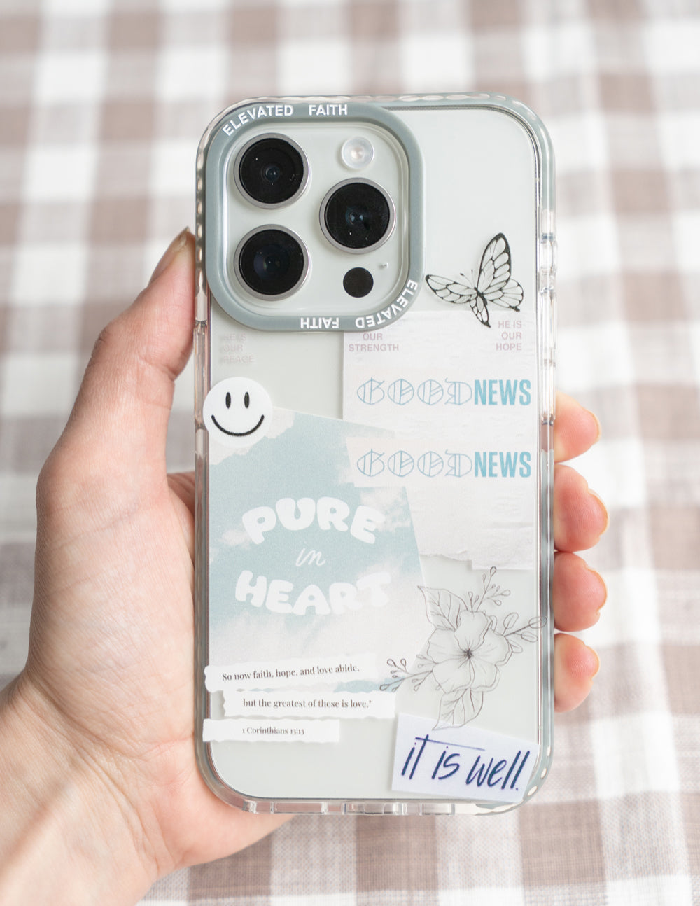 Transparent phone case with light blue border, butterfly print and 'PURE in HEART' design